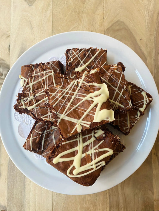 Dark Chocolate Brownie decorated with white chocolate icing