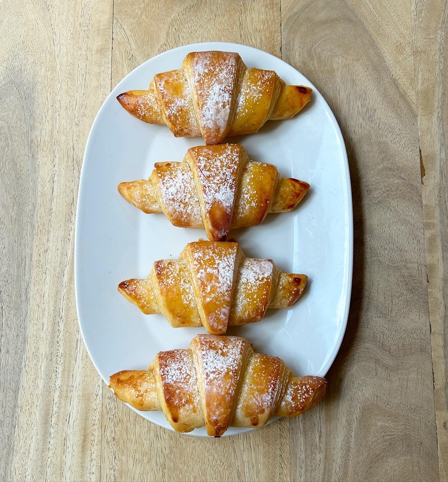 Fresh Croissants sprinkled with sugar 