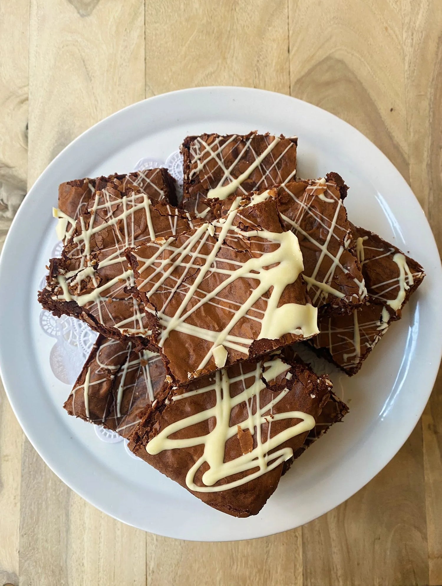 Dark Chocolate Brownie decorated with white chocolate icing 