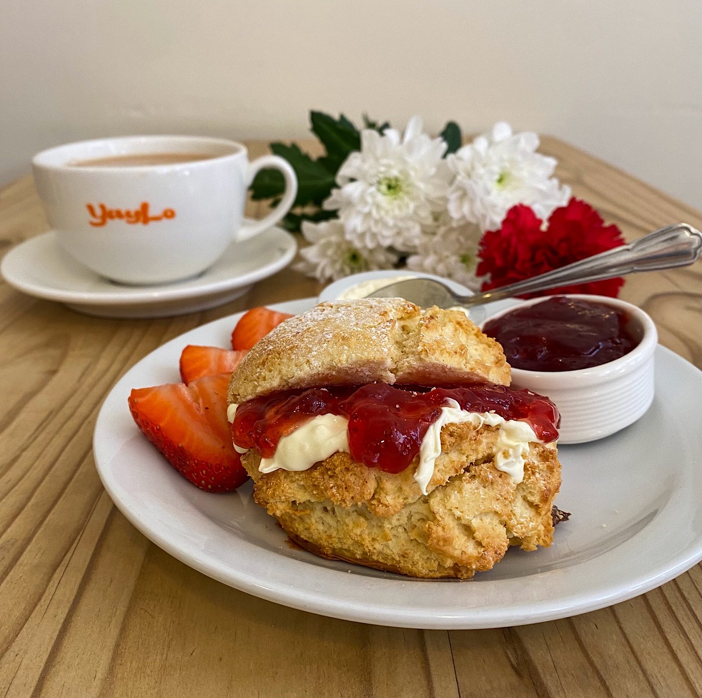 Scone and Jam and cream on plate